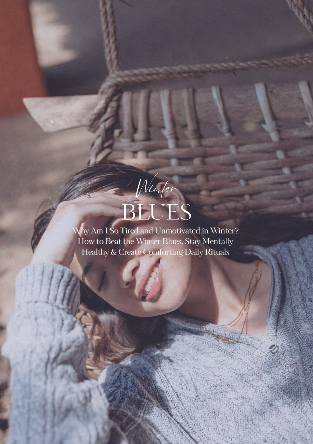Woman smiling despite feeling tired in winter, representing beating the winter blues with self-care and daily rituals